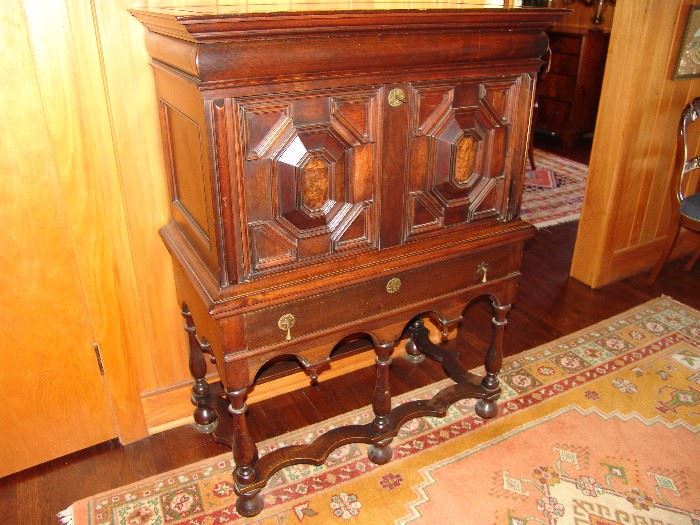 Rare and unusual William and Mary style secretary/chest with different woods, two doors and one large linen drawer