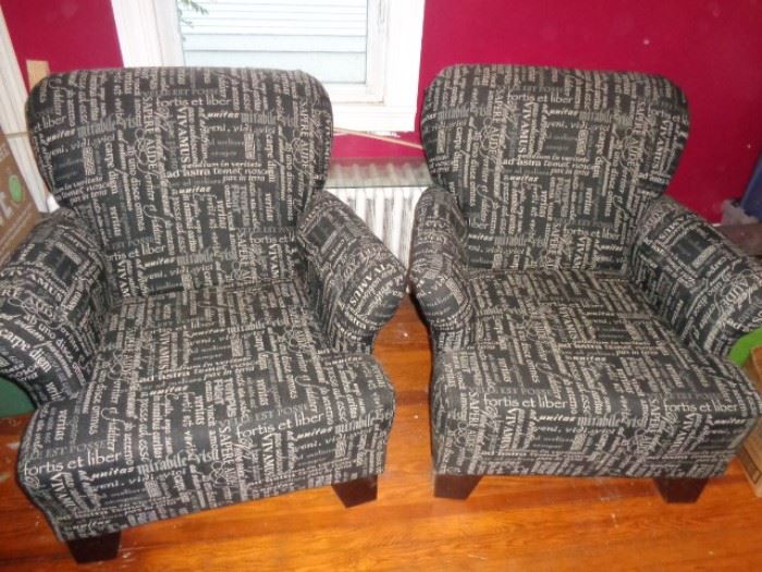 Pair of upholstered wing chairs in Latin phrases fabric