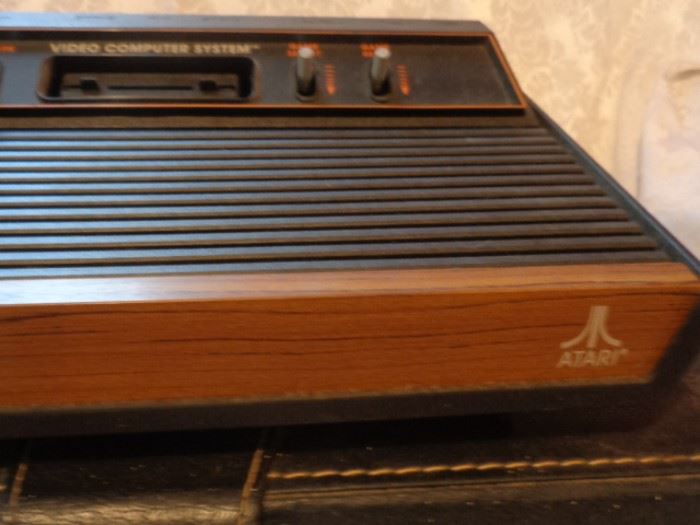 Vintage Atari system with many games in carrying cases
