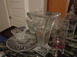 Many pieces of crystal, glass vases, decanters, storage pieces...