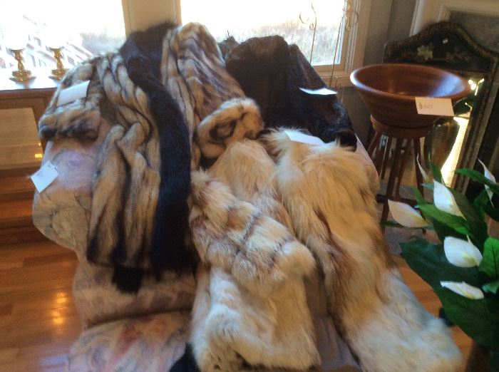 Collection of unusual fur coats. Mink, fox, lamb and a striped unknown with mink.