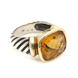 David Yurman Sterling Silver 7.90 CT Citrine Ring with 14K Yellow Gold Accents: A David Yurman sterling silver 7.90 ct citrine ring with 14K yellow gold accents. This ring features a center cushion checkerboard cut citrine stone within a gold gallery set between beveled sterling silver shoulders.