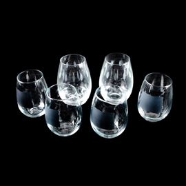 Collection of Stemless Wineglasses: A collection of stemless wine glasses. Included are four glasses with black chalk squares and two with an etched oval pattern. No maker’s marks are present.