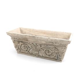 Peba Cast Stone Flower Pot: A Peba cast stone flower pot. This rectangular cast stone planter features a raised rim with tapered corners and an all over raised floral motif. Piece is marked to the underside.