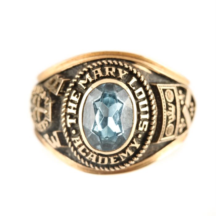 Herff Jones 10K Yellow Gold Spinel Class Ring: A Herff Jones 10K yellow gold synthetic spinel class ring. This class ring features a center synthetic spinel encircled by raised script “The Mary Louis Academy” and other class ring etchings.