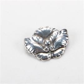 Sterling Silver Floral Brooch From Denmark: A sterling silver floral brooch with a textured petal motif with three beaded accents to the center. It has a Denmark hallmark to the underside.