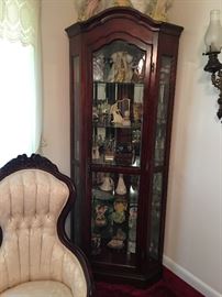 Large curio cabinet with mirrored back and glass shelves is perfect for displaying glassware and collectibles