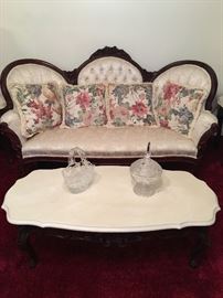 Victorian style tufted back sofa with nicely detailed coffee table....all are in new condition