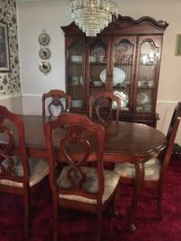 Dining room table, with leaf, 5 side chairs, 1 arm chair, and elegantly styled china cabinet....china cabinet has plentiful display and storage area