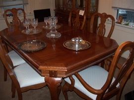 Table with two leaves and pads.  Four side chairs and two arm chairs (perfect condition)