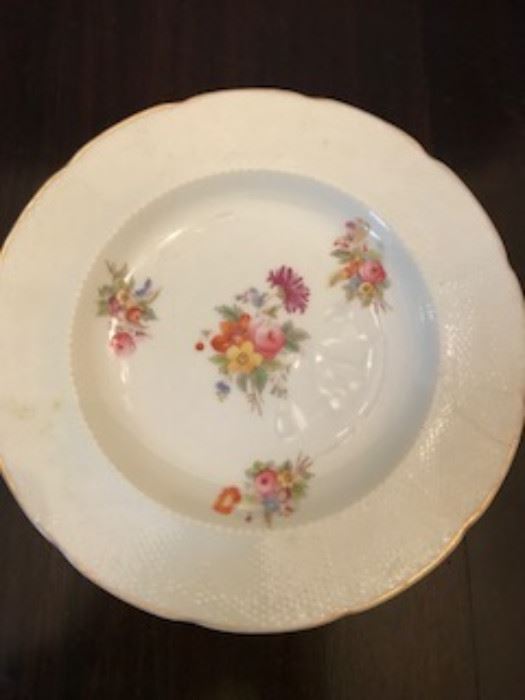 Vintage Tiffany plates, 7 in all and 11 bowls.