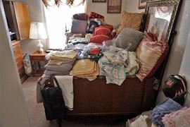 Vintage full-size bed and linen assortment