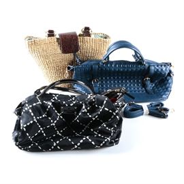 Assortment of Women's Handbags, Including Kate Spade: An assortment of women’s handbags. This assortment includes a Kate Spade Sew Be It Stevie satchel in a black nylon with white dotted windowpane print, black patent trim and black patent wrapped handles. The interior is lined in a red logo jacquard with black patent tag. The assortment also includes a wicker bag by Three Islands with embossed leather flap closure and braided leather straps, and a blue textured vinyl bag with gold-tone hardware, quilted vinyl handles, and removable adjusting vinyl strap.
