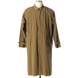 Men's Patagonia Tan Coat: A men’s Patagonia tan coat. This coat features a shirt collar, button closures, slash pockets, button cuffs and a half lining. It is labeled to the interior, “Patagonia, S, assembled in Costa Rica”.