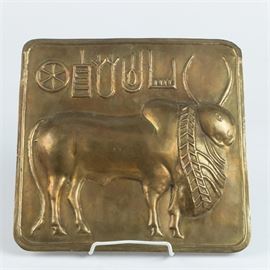 Indian Harappan Seal: “A reproduction metal plaque after a circa 2200 B.C Harappan seal. In shallow relief this depicts a zebu bull, with five characters on Indus script in the upper left. This hieroglyphic writing has yet to be decoded, although it is known that these seals were used for trade. The plaque has a triangular hook attached on verso for hanging, however no discernible maker’s mark could be found.