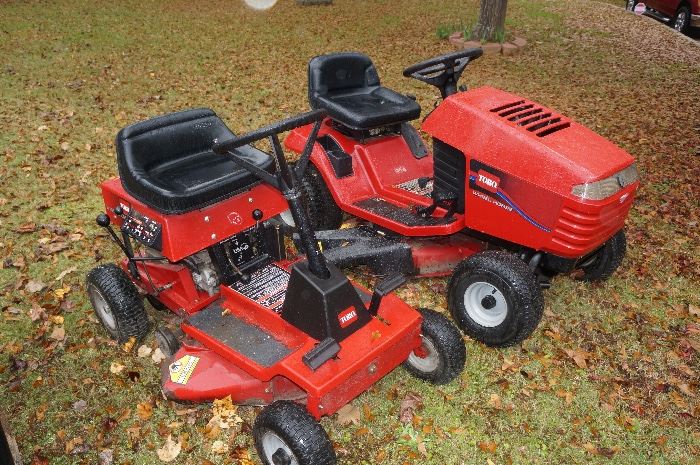 Several riding mowers