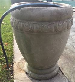 Stone Planter Holding Garden Hose,