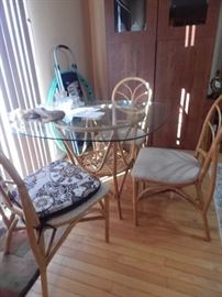 Kitchen glass table with Rattan chairs