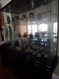 China cabinet with lovely smalls... tea cups and other china pieces. Bar ware as well. Initial M on bar glass ware.