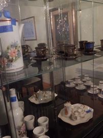 Tea cups and other items found in the china cabinet.
