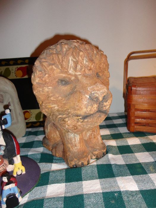 Either for the garden or indoors this delightful lion measures about 10" tall and is quite heavy.  