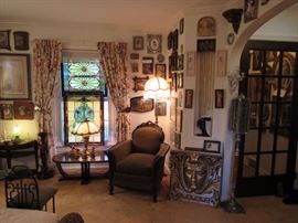 This Victorian arm chair and two stained glass windows steel the scene but don't miss the other details including the Funeral Holy Card Holder to the right in front of the door. 