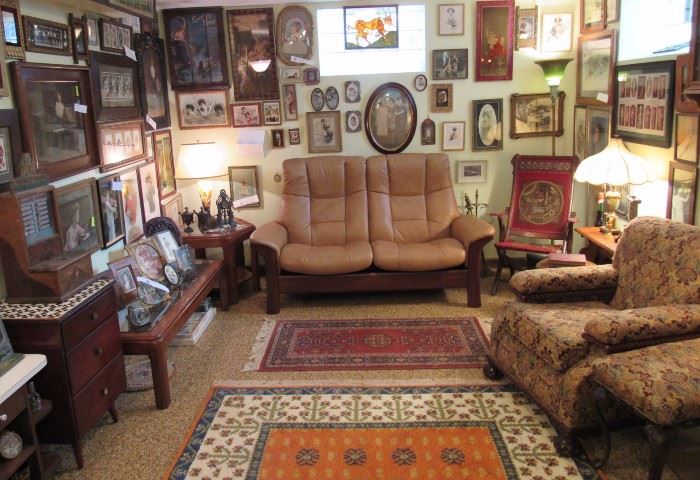 One of a kind leather two seater, beautifully upholstered arm chairs and ottomans, area rugs, Victorian and early 20th Century tables and chests, display cases, amusement games...