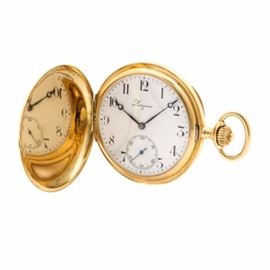 Longines 18K Yellow Gold Hunting Case Pocket Watch: A Longines 18K yellow gold hunting case pocket watch. This pocket watch features an 18K yellow gold bright polished hunting case, which houses a white dial, with black Arabic numerals, indexes and breguet moon style hands. There is a sunk seconds sub dial at the six hour mark. A tan storage pouch is included.