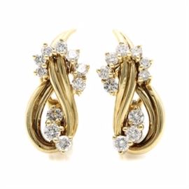 Gucci 18K Yellow Gold 1.08 CTW Diamond Earrings: A pair of Gucci 18K yellow gold 1.08 ctw diamond earrings. Each openwork earring is intertwined with a twisting row of round brilliant cut diamonds.
