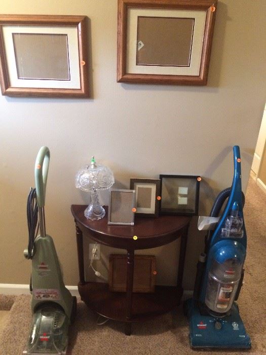 Vacuum cleaner, carpet/upolstery machine, photo frames, small wall table, glass lamp