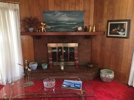 Asian fish pot, brass swans, brass elephant, mantle clock, submarine coffeee table book, glass top w/ brass base coffee table.