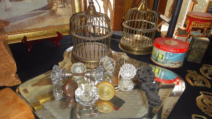 Crystal door knobs, brass bird cages 