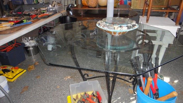 Glass top table with wrought iron base