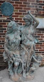 Dancers in a bronze statue.