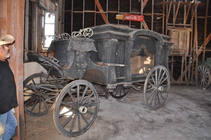 Funeral Hearse. In fair condition, needs some repairs, rolls and turns well. Great coach for restoration. Pine Box included. This item may not have all parts such as hitch, yokes, etc... As Is