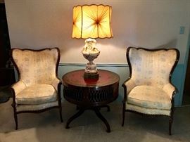 Handsome High Back Winged Arm Chairs, 1940s Leather Top & Leather Button Tuck Side Drum Table, Huge Vintage Italian  Art Ceramic Cherubs Table Lamp