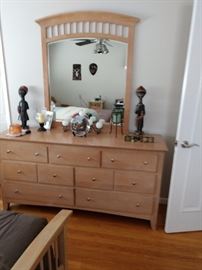 Full  Bedroom suite with dresser, matching bed and bedside table.