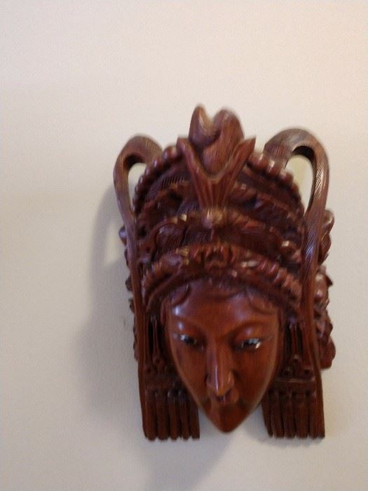 One of two asian  carved masks