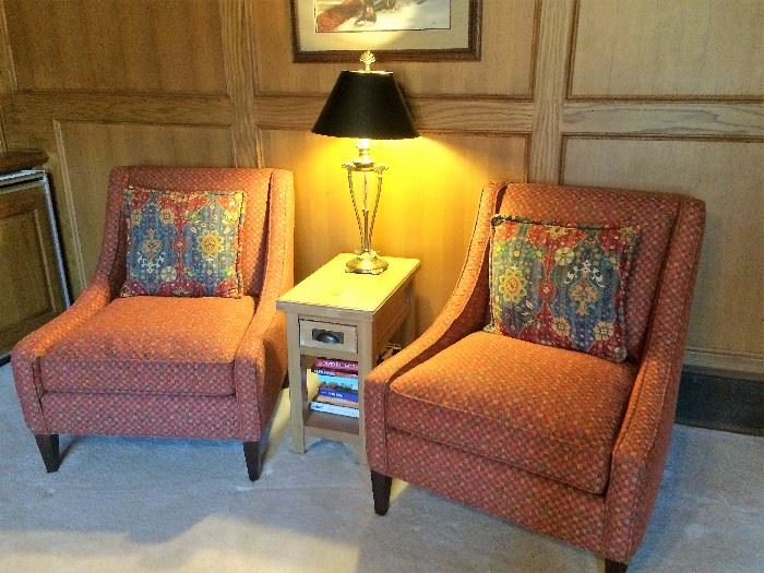 matching chairs and small table   lamp and art