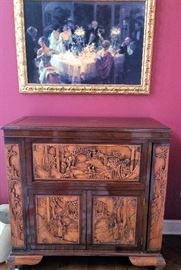 Beautiful Hand carved bar or liquor cabinet server top opens up and sides open out        