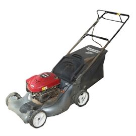 Craftsman 6.5 HP Lawn Mower: A Craftsman 6.5 HP lawn mower. This mode no. 917.376523 features a 21" blade a dust bag and is powered by gasoline.