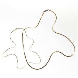 Pair of Italian 14K Yellow Gold Herringbone Necklace Chains: A pair of Italian-made 14K yellow gold herringbone necklace chains in graduated sizes.