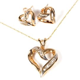 10K Yellow Gold and Diamond Open Heart Demi Parure: A 10K yellow gold and diamond demi parure comprising a pendant necklace and pair of stud earrings. The earrings and pendant feature an open heart shape embellished with round and baguette cut diamonds.