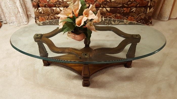 Oval glass top coffee table with wood base