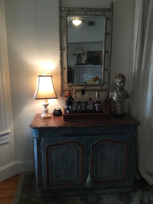 Blue painted French Provençal sideboard, faux marble top, bamboo mirror, silver bust. 