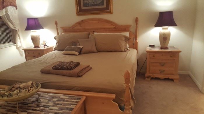 King size bed with two nightstands and dresser with mirror