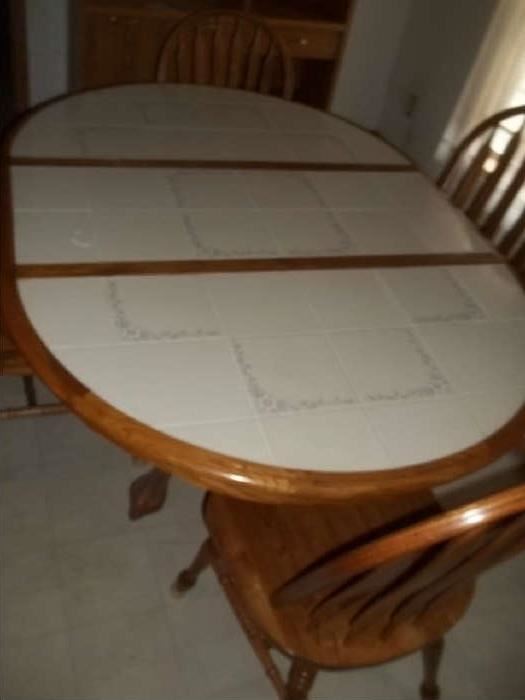 tile topped table and 4 chairs $250