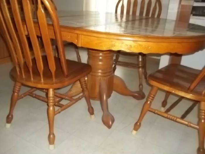 tile topped pedestal table and 4 chairs  $250