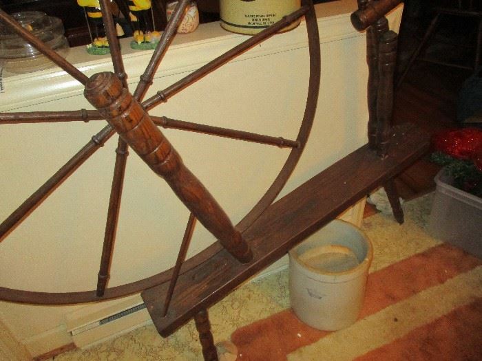 Handcrafted spinning wheel.  Crock has sold.