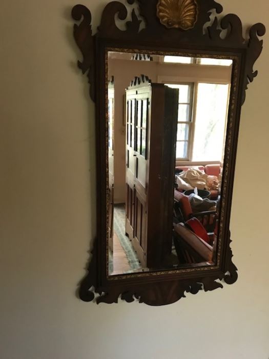 Another chippendale style mirror with the antique eastern NC corner cupboard reflected.